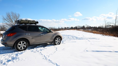 Nissan with a Yakima Rack on Top in the Snow