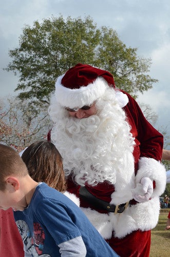 Santa handing out candy during the holidays