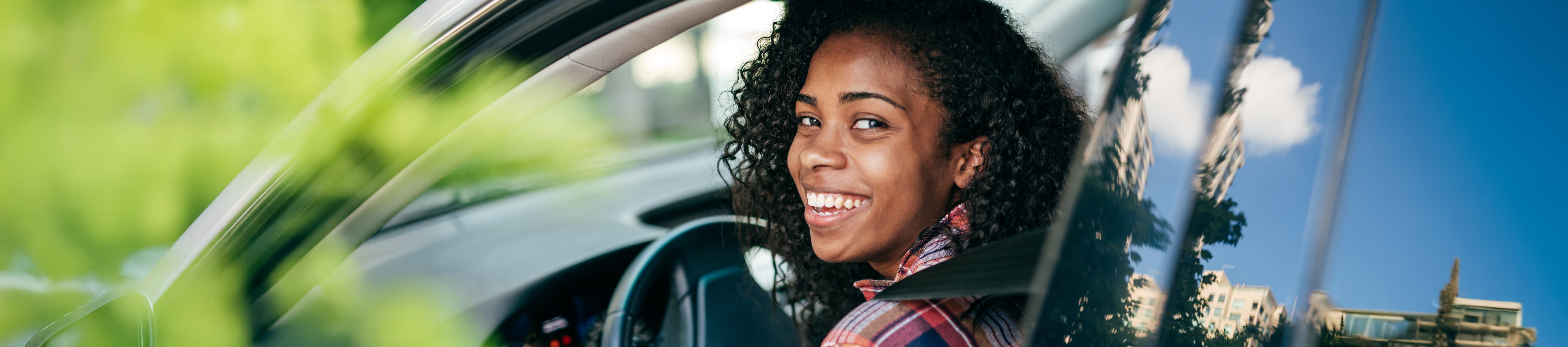 Student sitting in a new vehicle