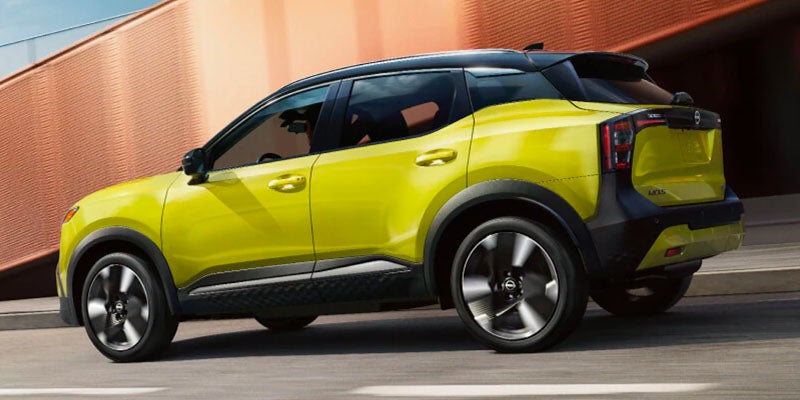 Lime green 2025 Nissan Kicks facing left in Bourbannais, IL