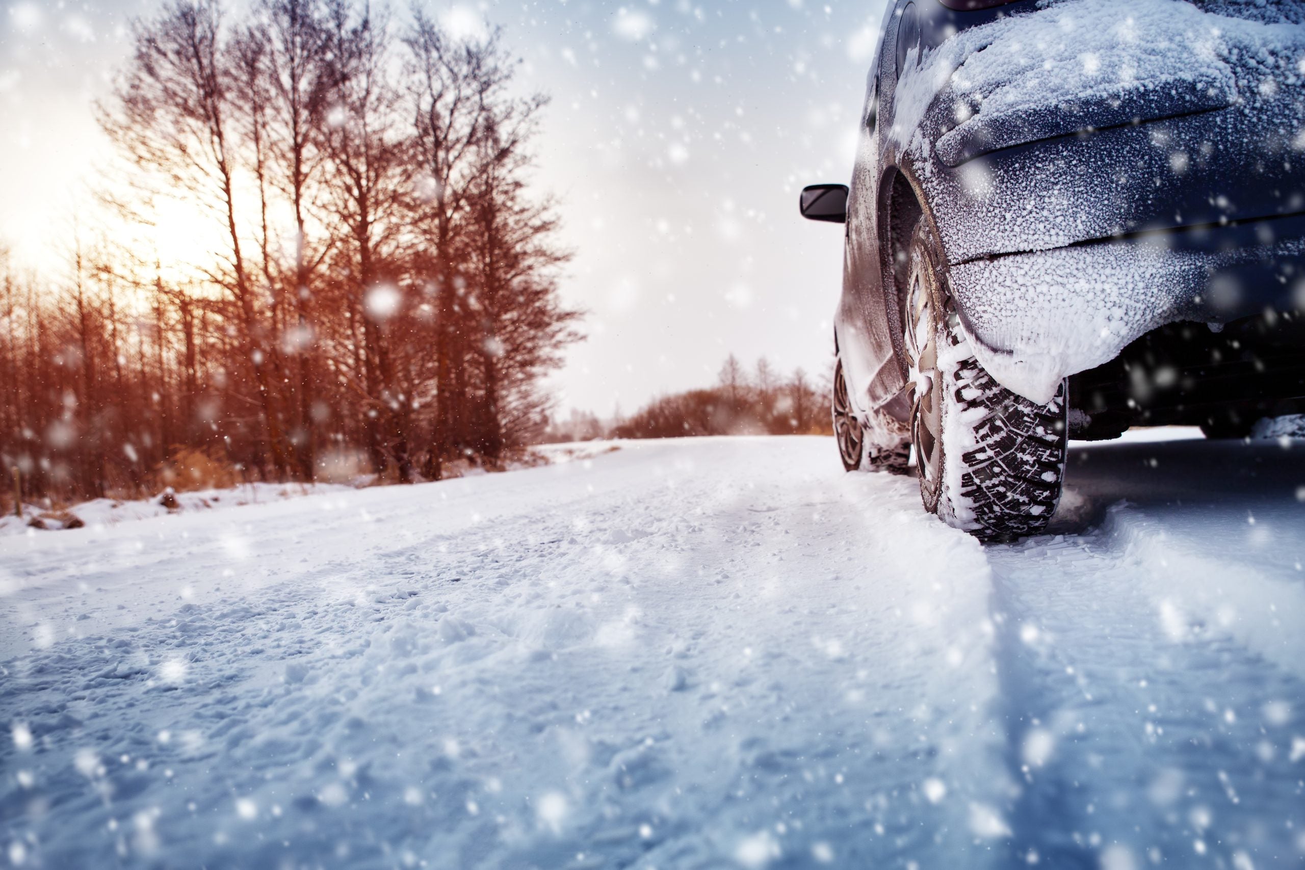 Car,Tires,On,Winter,Road,Covered,With,Snow.,Vehicle,On