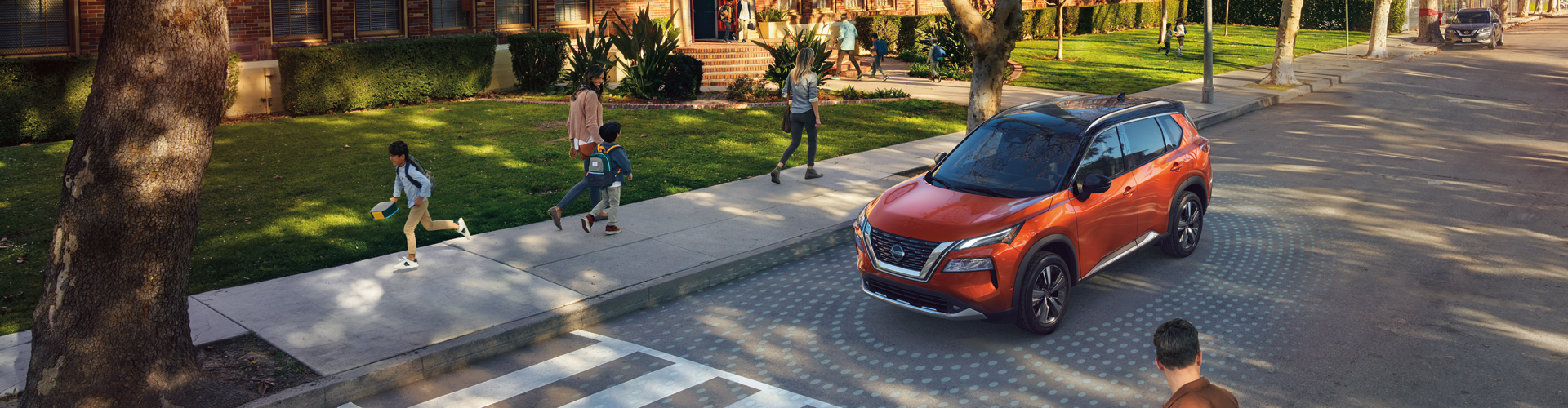 New Nissan Rogue in School Zone with Safety Features Shown