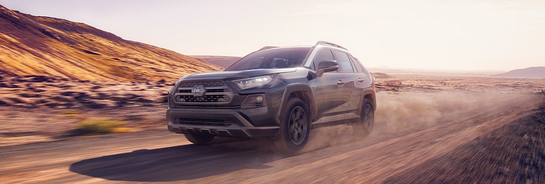 Model Features of the 2022 Honda Pilot at Bobby Rahal Honda of State College | RAV4 driving fast on turn