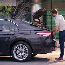 Model Features of the 2022 Toyota Camry at Bennett Toyota | Guy uses Camry's trunk space