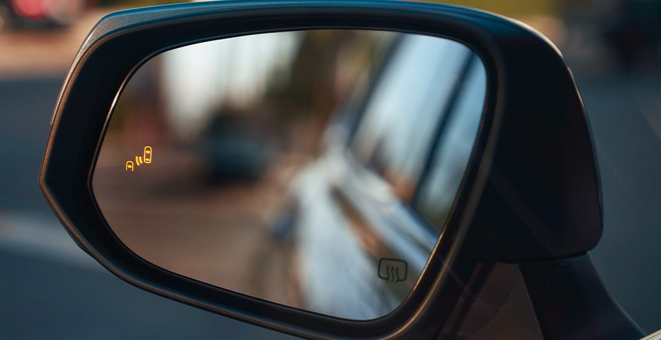 Model Features of the 2021 Toyota Highlander at Bennett Toyota | Side Mirror on the 2021 Toyota Highlander Displaying Lane Assist & Heater