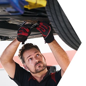 Basic Car Maintenance and Servicing Checklist | Toyota Mechanic drains oil from oil pan