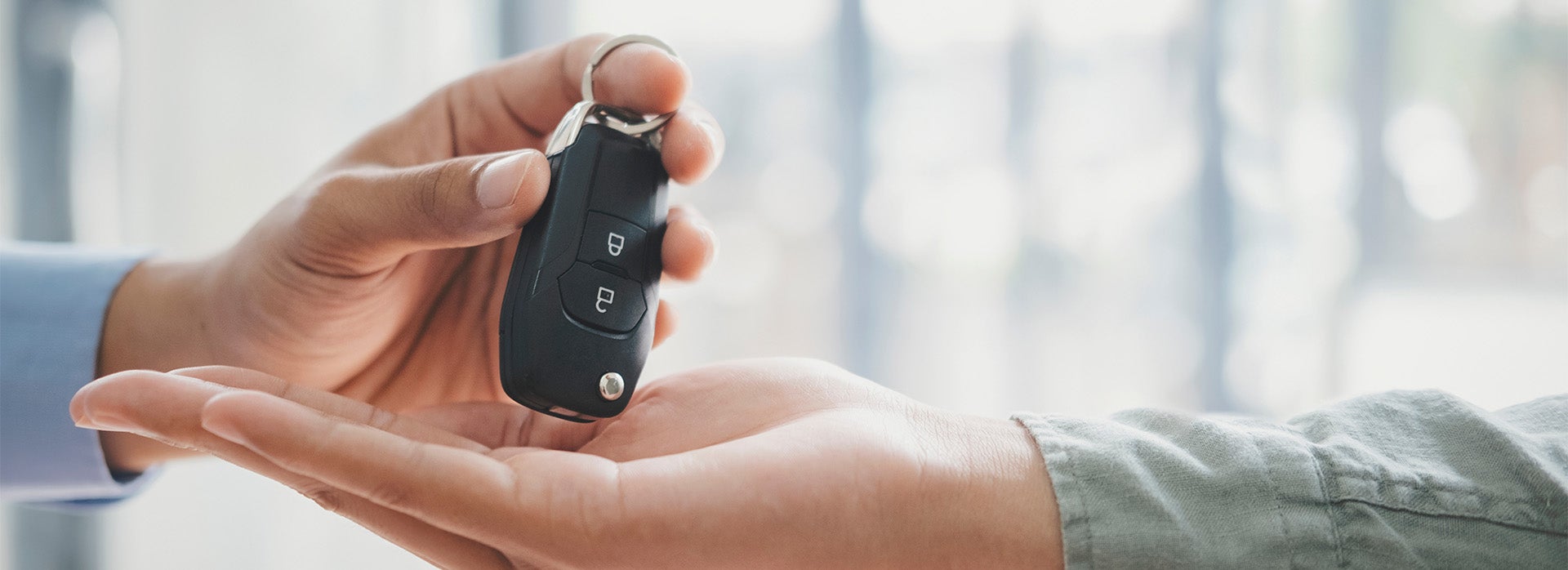 High Cost of Replacing a Car Key | Bennett Toyota in Allentown, PA | Car Sales Associate Handing Customer Car Keys