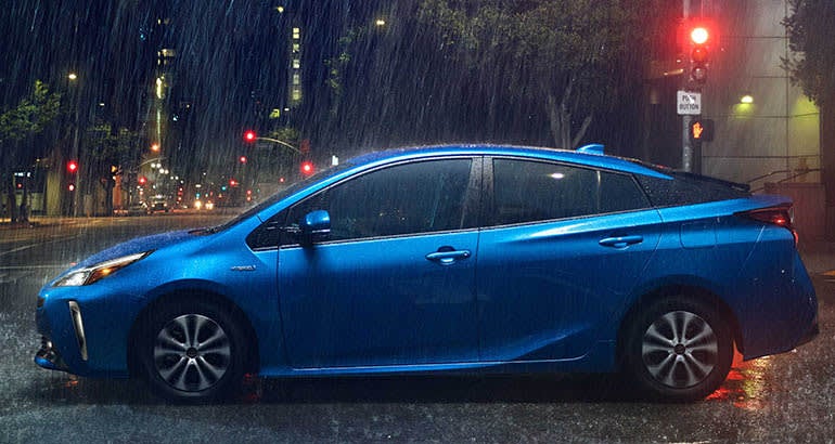 Image of a blue 2019 Toyota Prius in the rain.