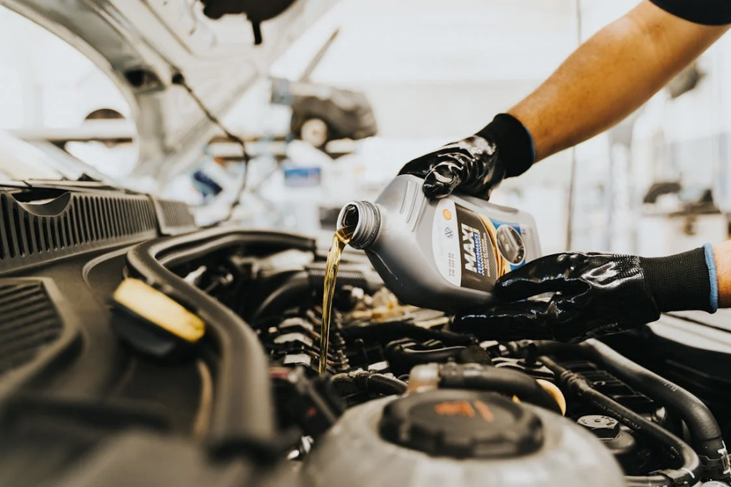 pouring oil to engine
